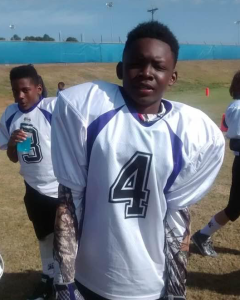 Deyon Bouie as a child in a football uniform